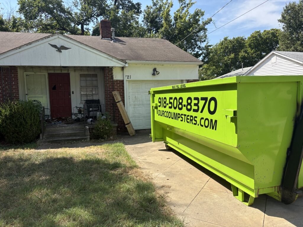 Durco dumpster in front of a home for a pre-holiday cleanout