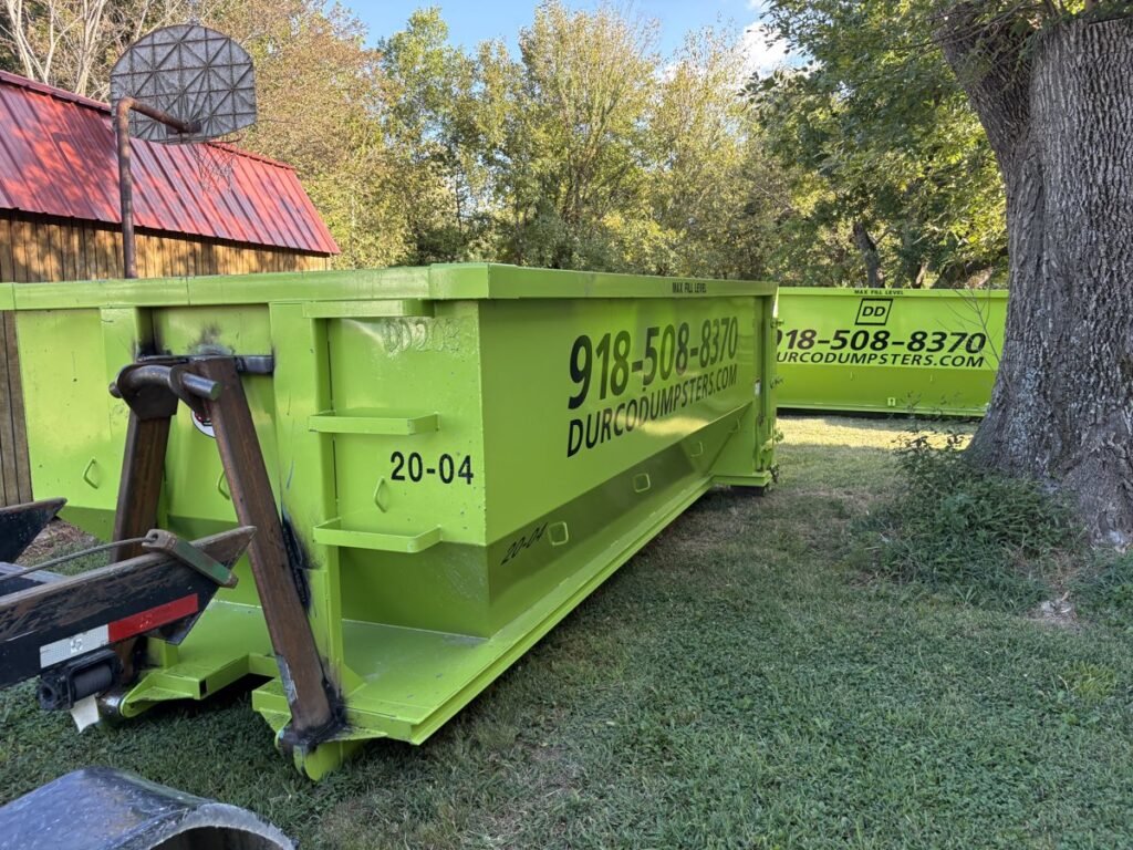 Durco Dumpster Rentals roll-off dumpster in a Tulsa-area yard for storm debris cleanup
